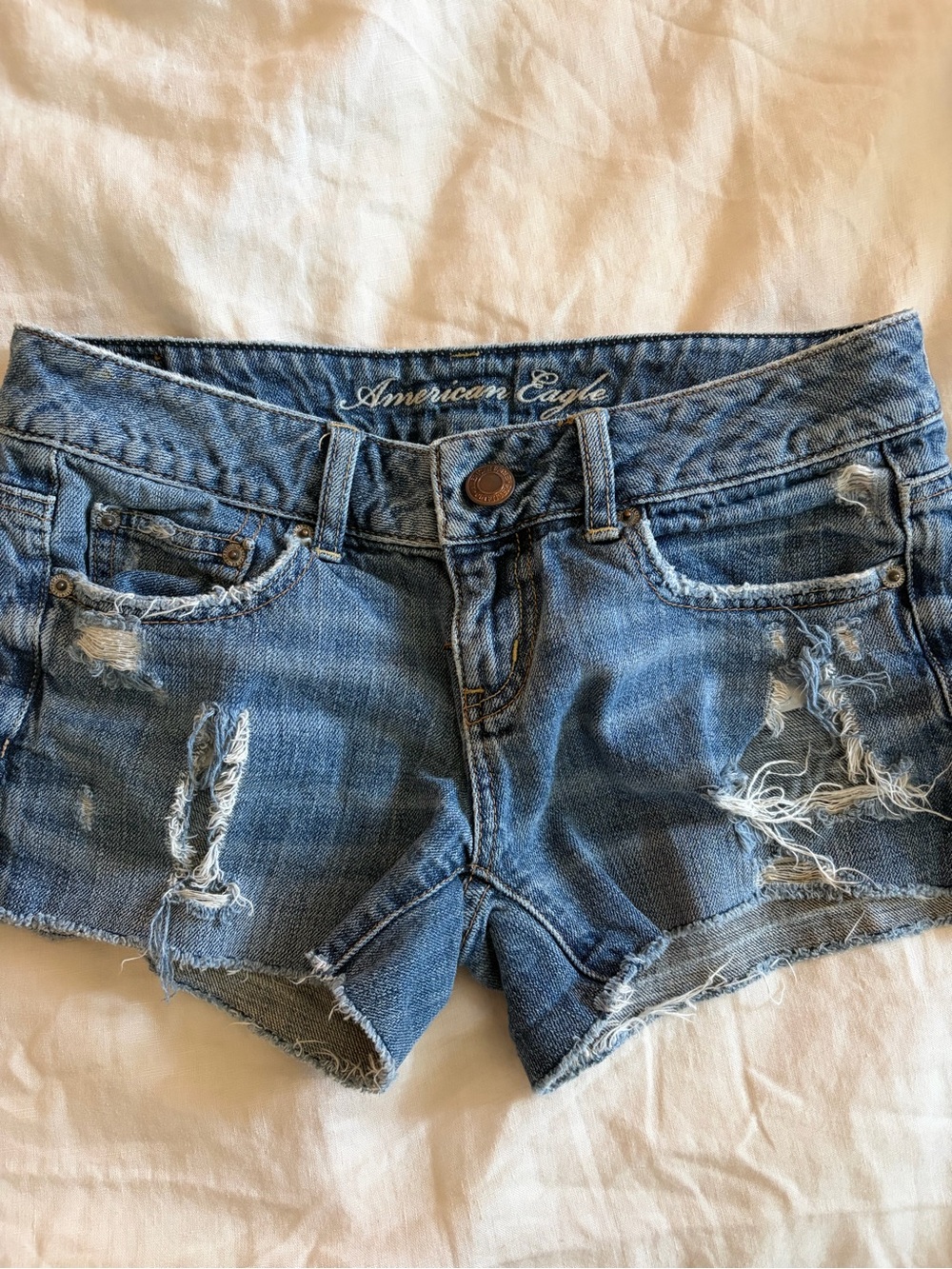 2000s American Eagle Ripped Light Blue Denim Shorts